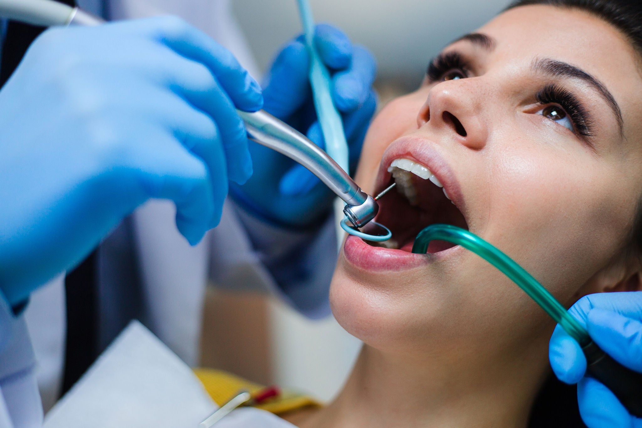 Taking a closer look. Close-up of dentist examining his beautiful patient in dentist’s office, Taking a closer look. Close-up of dentist examining his beautifu