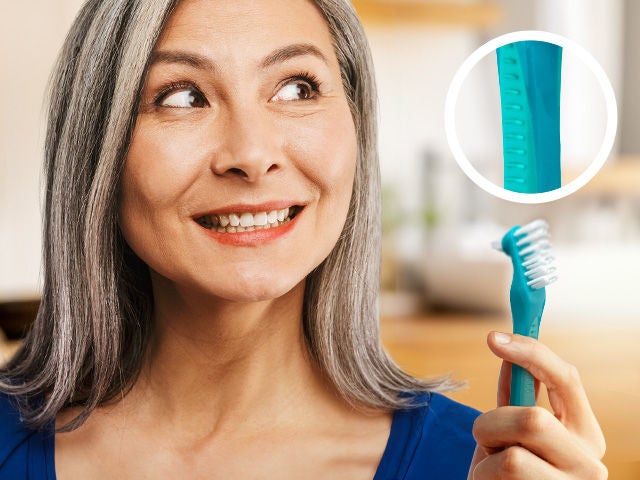 Smiling Woman Holding the GUM DENTURE brush and zoom in on the non-slip handle