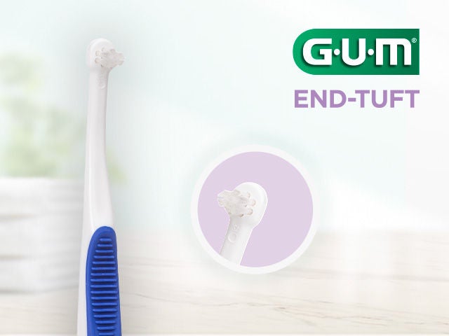 GUM END-TUFT toothbrush wih a zoom in on the extra-small conical head