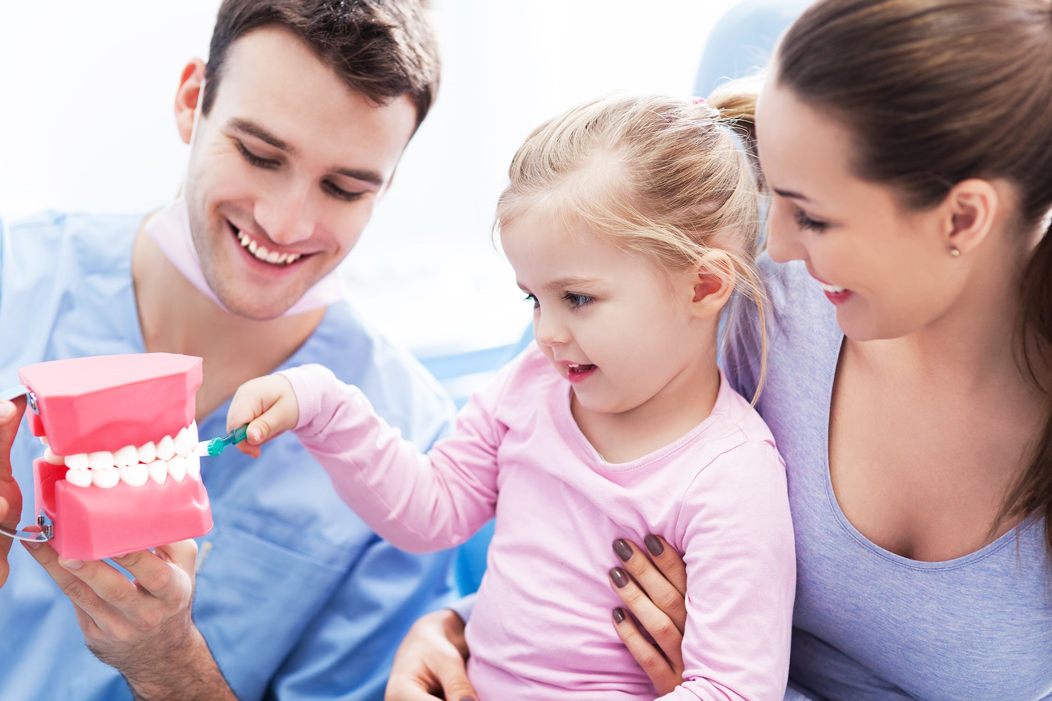 OCP-Hygienist-with-little-girl-and-mother