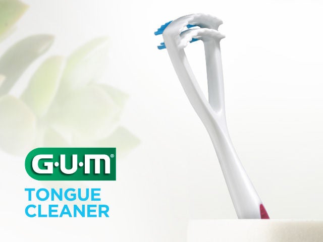 GUM TONGUE CLEANER focusing on the tool