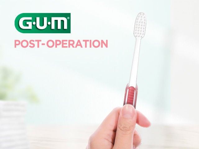 GUM Post-Operation toothbrush in a hand to show the non-slip handle