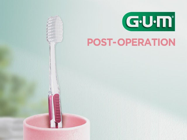 GUM Post-Operation toothbrush placed in a glass