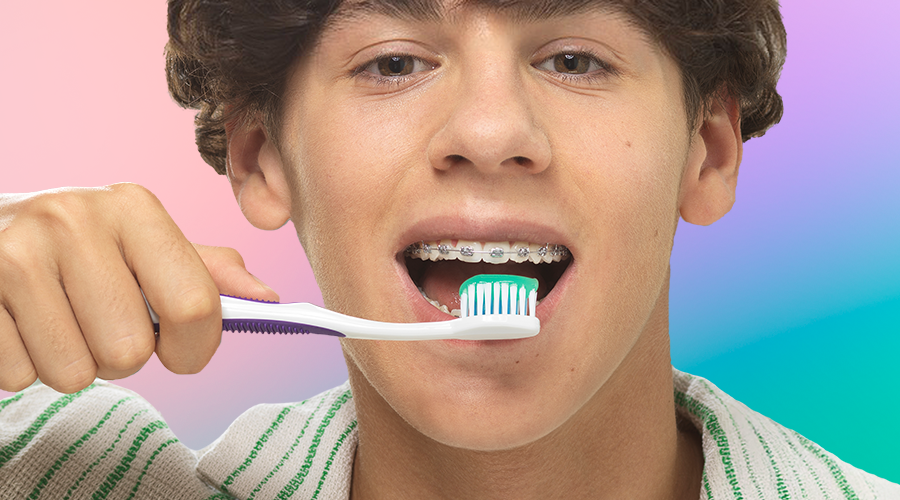 Teenager with braces is brushing teeth with the GUM ORTHO Toothbrush