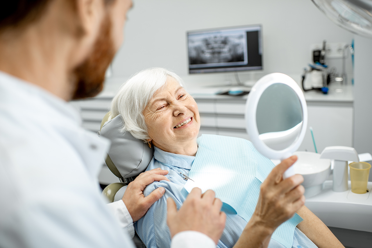 Woman-old-smiling-saving-her-teeth