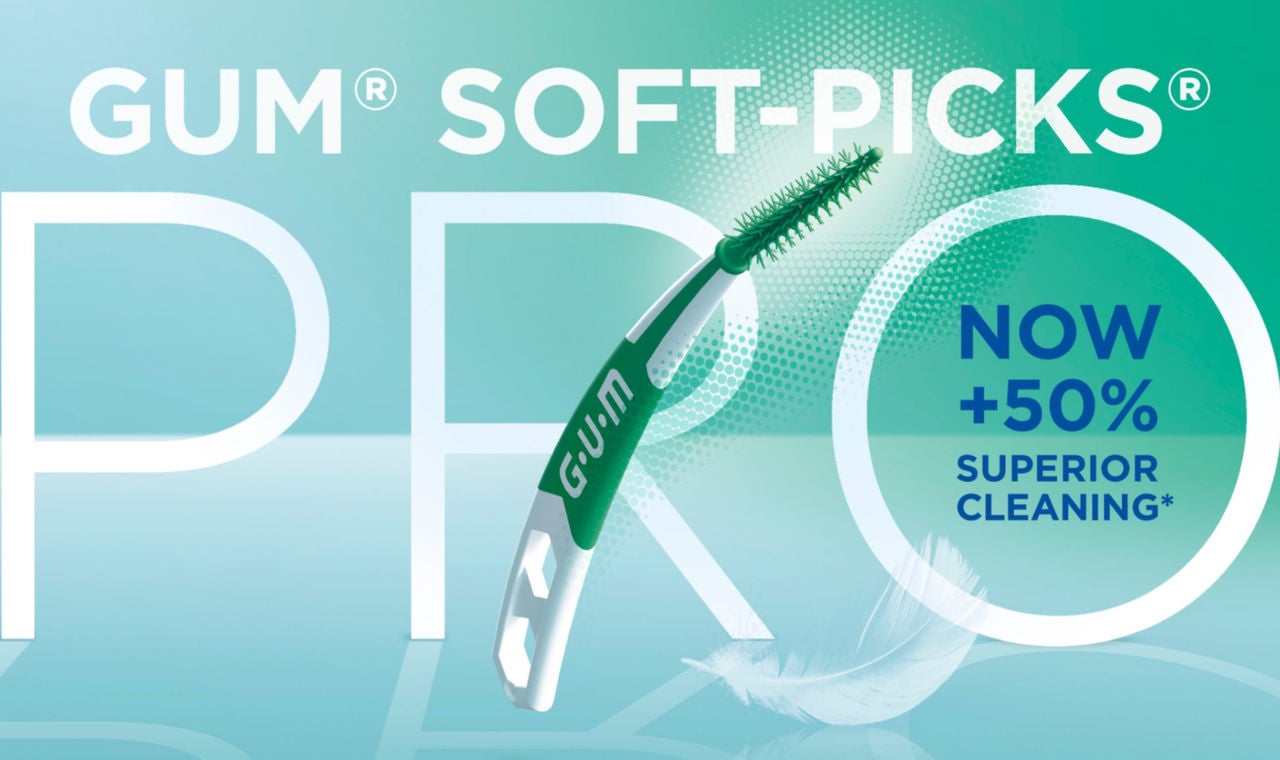GUM SOFT-PICKS-PRO interdental cleaner, a feather and  a circled icon with  +50% for a superior cleaning